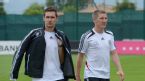 Germany's Miroslav Klose and Bastian Schweinsteiger arrive for a team photo session&nbsp;<span style=